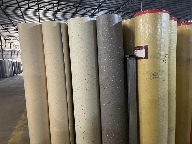 checking for defects on a pvc floor roll production line